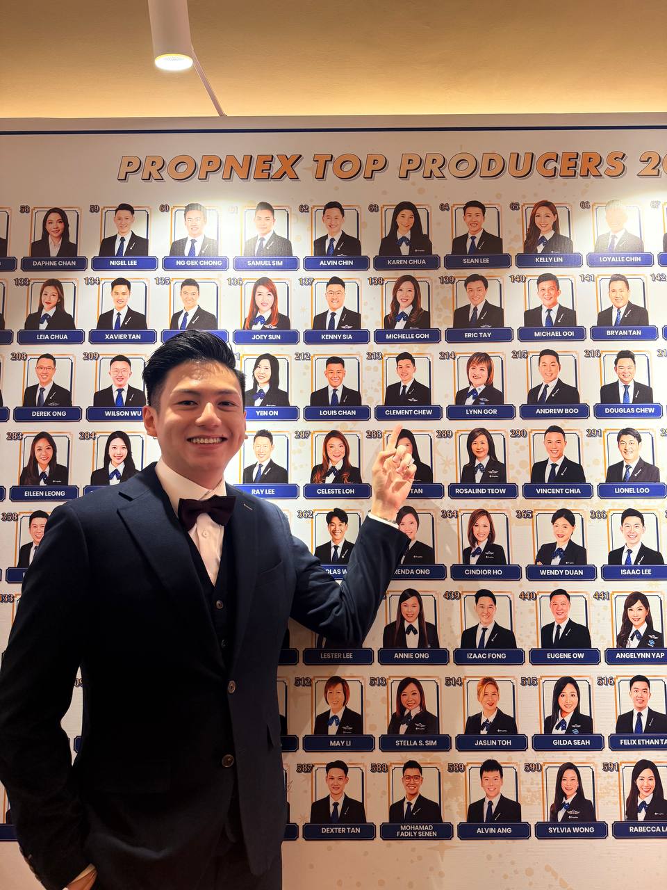 Clement Chew at the PropNex Top Producers recognition wall